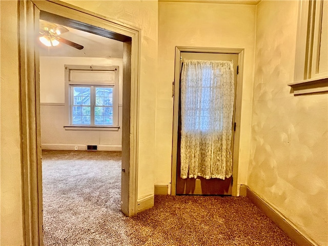 corridor featuring carpet floors