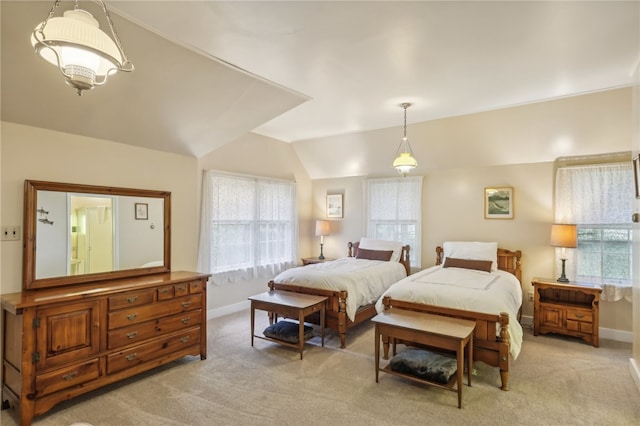 bedroom featuring lofted ceiling and light colored carpet