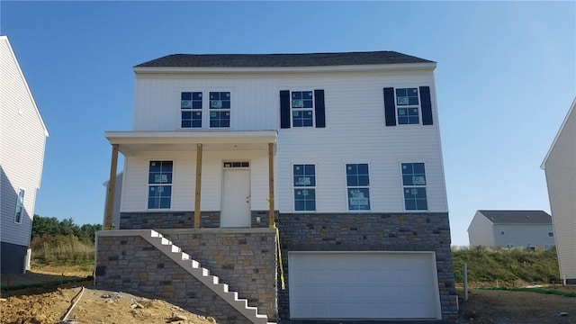 view of front of property with a garage