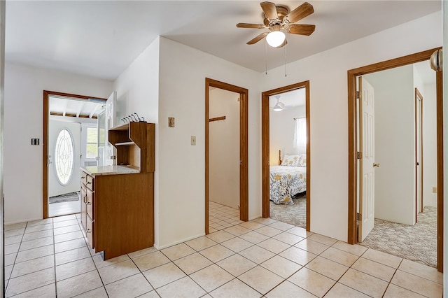 interior space featuring ceiling fan