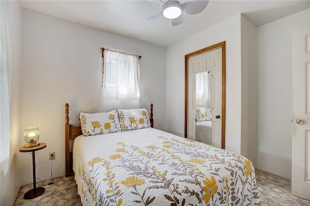 bedroom with ceiling fan and carpet flooring