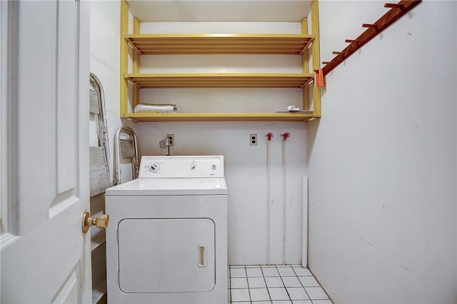 washroom featuring washer / clothes dryer and light tile patterned floors