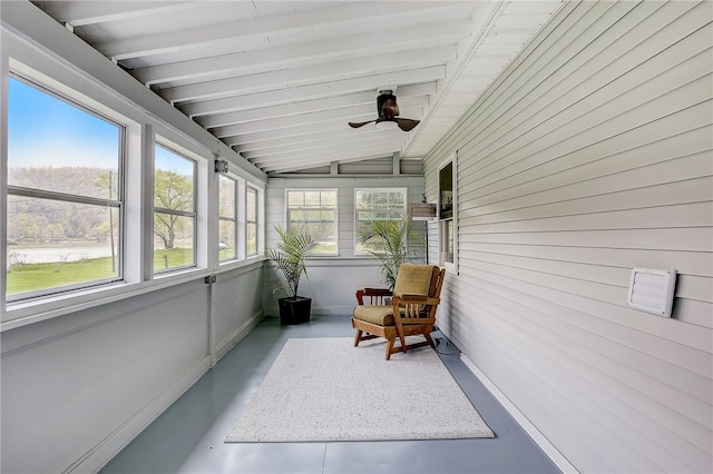 sunroom / solarium featuring lofted ceiling with beams and ceiling fan