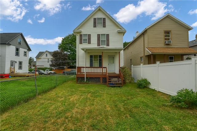 back of property with a lawn and cooling unit