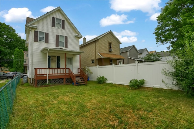 rear view of property with a yard