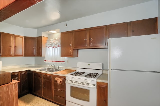 kitchen with sink and white appliances