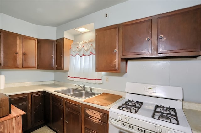 kitchen with sink and gas range gas stove