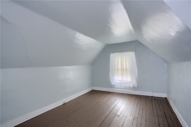 bonus room featuring hardwood / wood-style flooring and vaulted ceiling