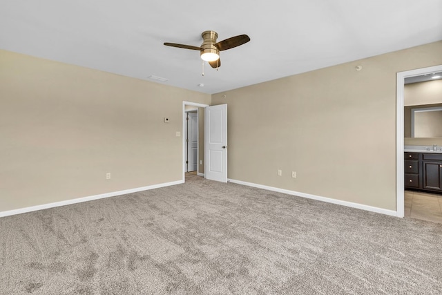 unfurnished room featuring light colored carpet and ceiling fan