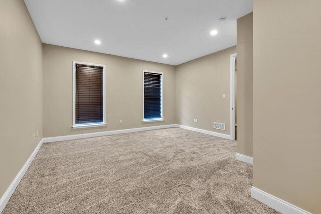 empty room featuring carpet flooring