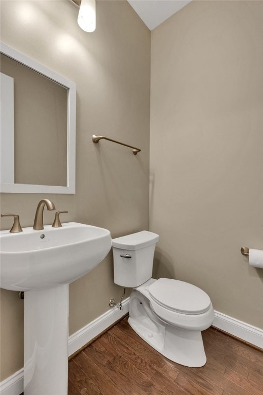 bathroom featuring toilet and hardwood / wood-style floors