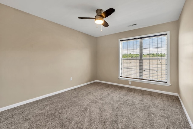 spare room featuring carpet flooring and ceiling fan