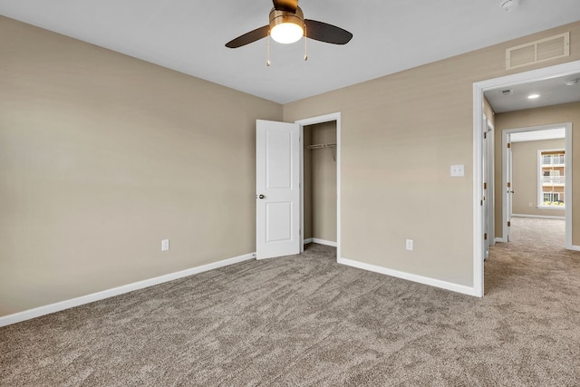 unfurnished bedroom featuring a closet, carpet, and ceiling fan