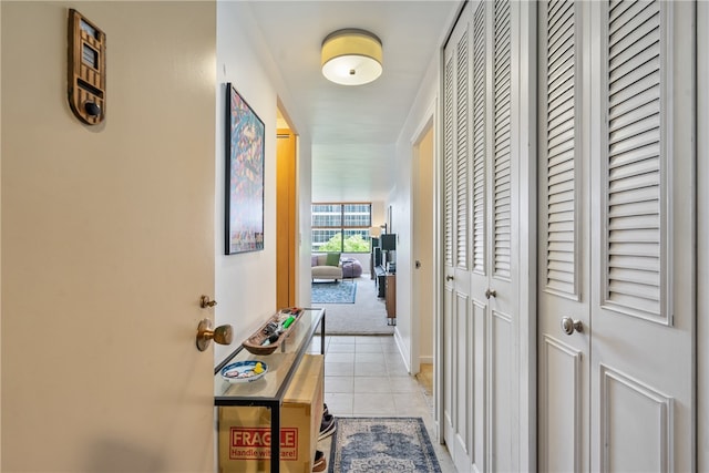 corridor featuring light tile patterned flooring