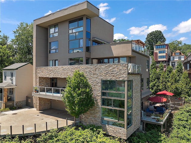 back of house with a balcony