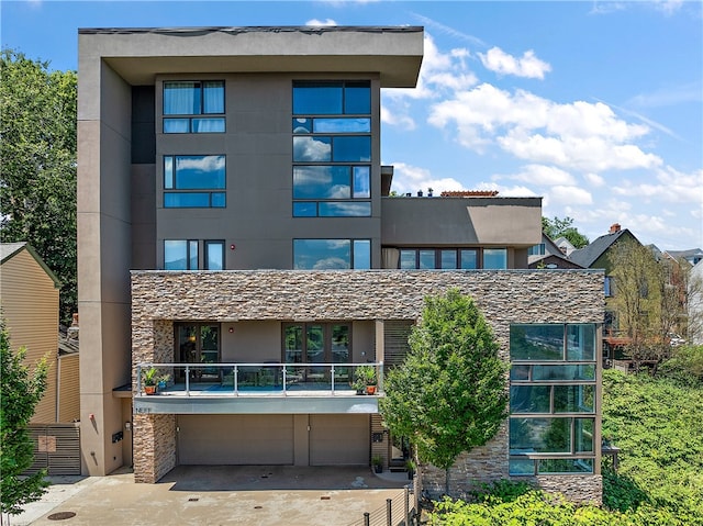 exterior space with a balcony and a garage