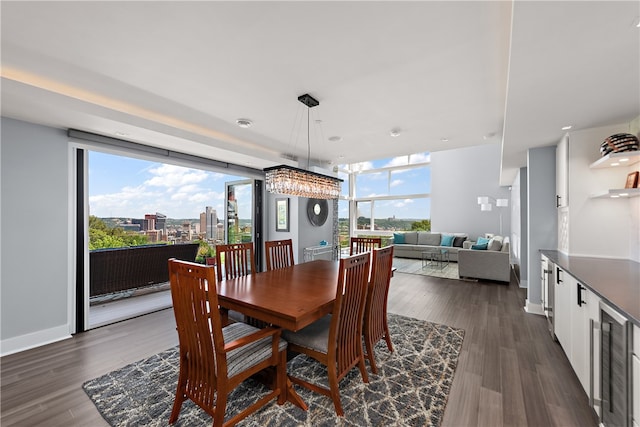 dining room featuring beverage cooler and dark hardwood / wood-style flooring