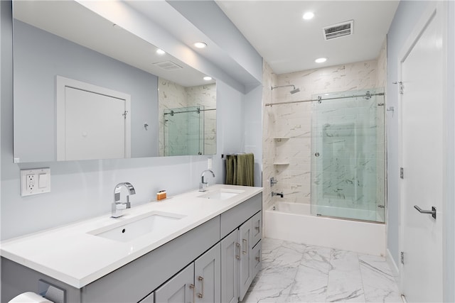 bathroom with tile patterned flooring, double sink vanity, and shower / bath combination with glass door