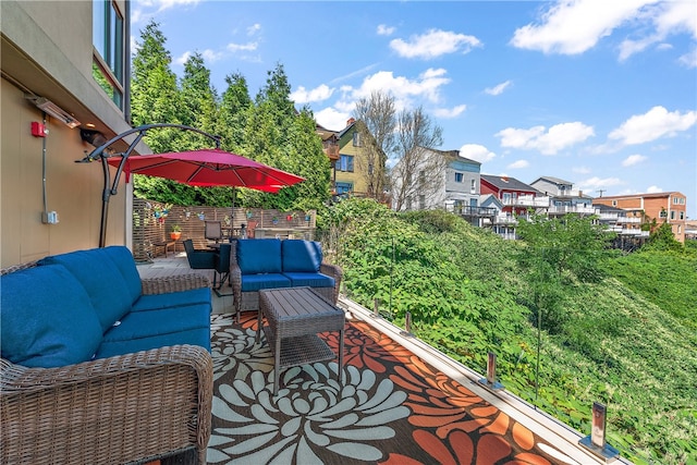 exterior space with a balcony and an outdoor living space