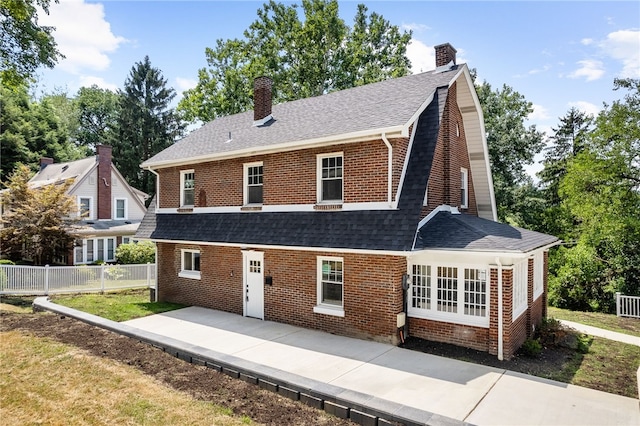 rear view of property featuring a patio