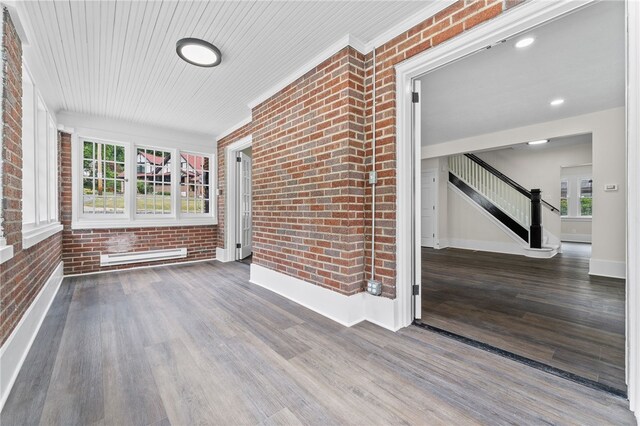 unfurnished sunroom featuring a baseboard radiator