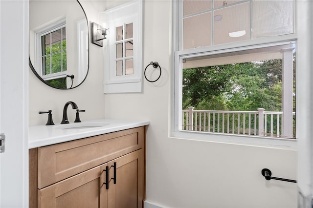 bathroom with vanity and a wealth of natural light