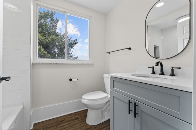 full bathroom featuring vanity, toilet, shower / bathing tub combination, and hardwood / wood-style flooring