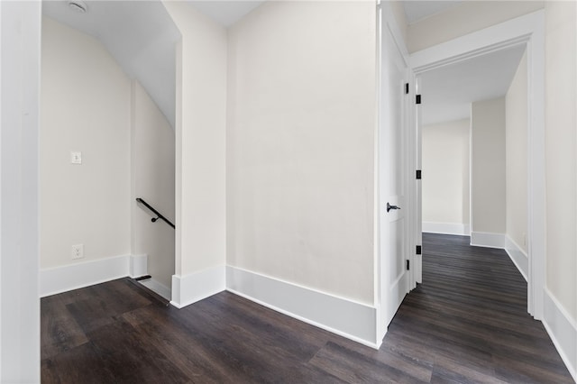 hallway with dark wood-type flooring