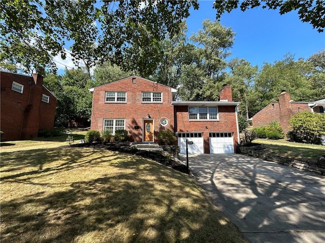 view of front facade with a garage and a front lawn