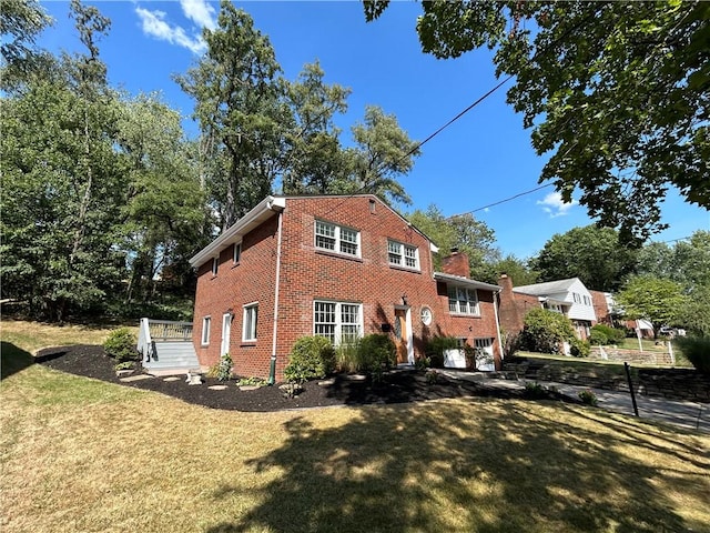 view of home's exterior featuring a yard