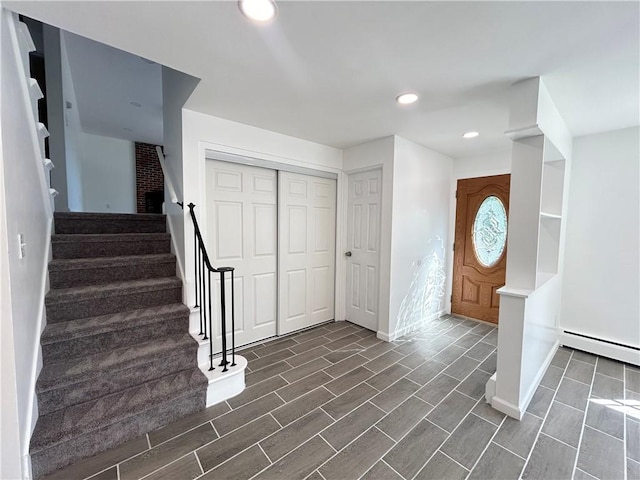 entrance foyer featuring a baseboard heating unit