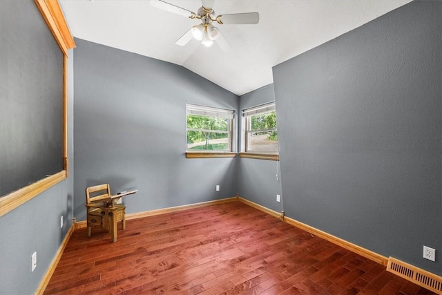 unfurnished room featuring lofted ceiling, wood-type flooring, and ceiling fan