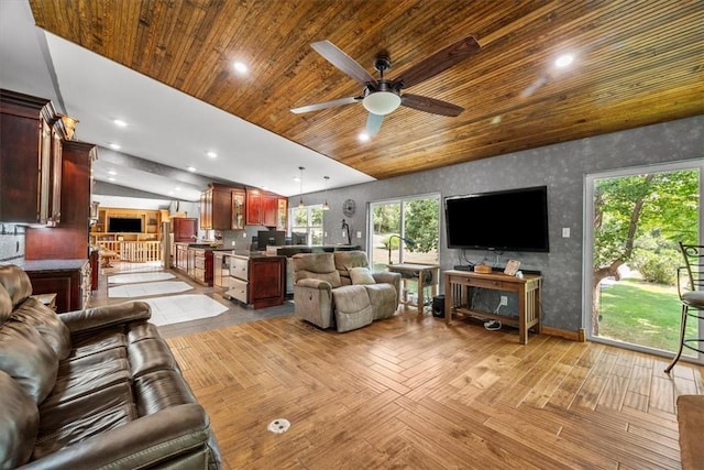 living room with ceiling fan, light parquet flooring, vaulted ceiling, and wood ceiling