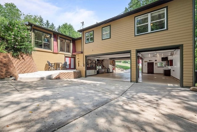 rear view of house featuring a garage