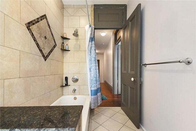 bathroom with shower / bath combo and hardwood / wood-style floors