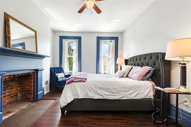 bedroom with dark wood-type flooring and ceiling fan