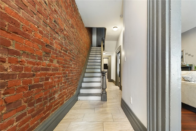 stairway with brick wall