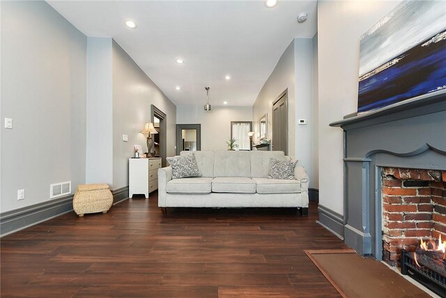 living room featuring dark hardwood / wood-style flooring