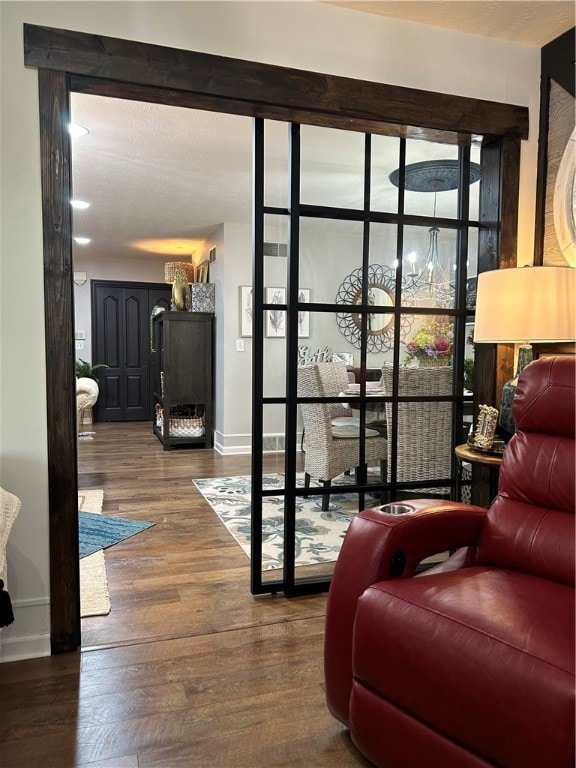 doorway with hardwood / wood-style floors