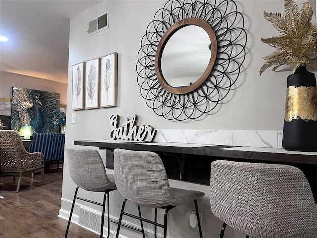 dining area featuring wood-type flooring