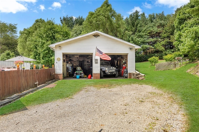 garage featuring a lawn