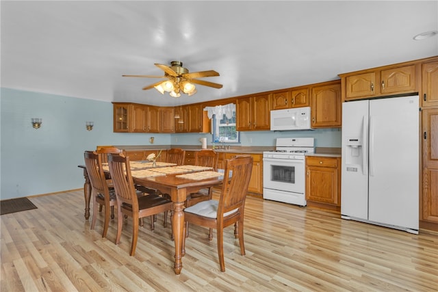 kitchen with ceiling fan, sink, light hardwood / wood-style flooring, and white appliances