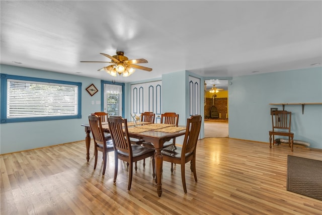 dining room featuring light hardwood / wood-style floors and ceiling fan