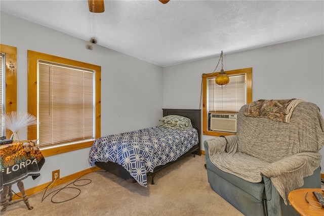 carpeted bedroom featuring cooling unit and ceiling fan