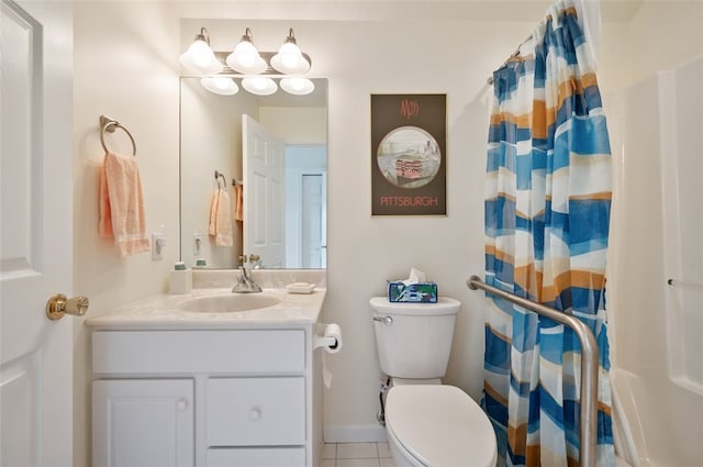 bathroom with a shower with shower curtain, vanity, toilet, and tile patterned floors