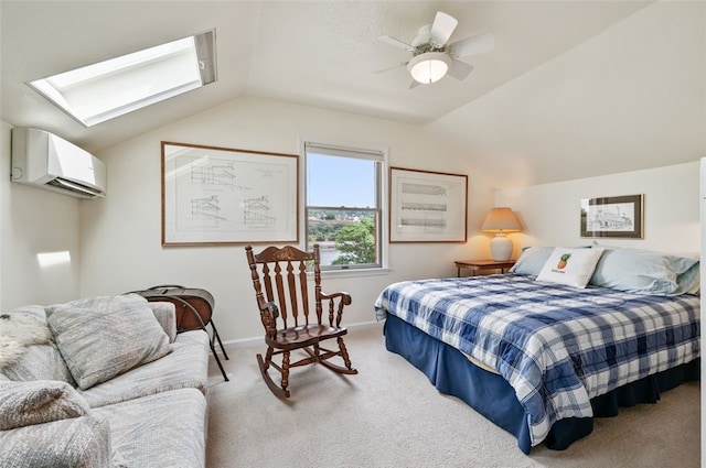 carpeted bedroom featuring vaulted ceiling with skylight, baseboards, a ceiling fan, and a wall mounted air conditioner