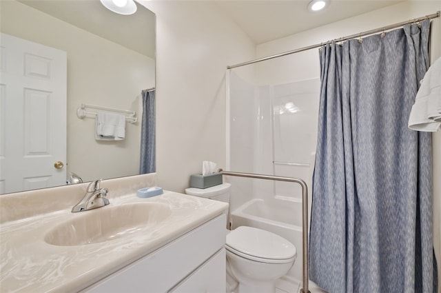 bathroom featuring vanity, toilet, and shower / tub combo with curtain