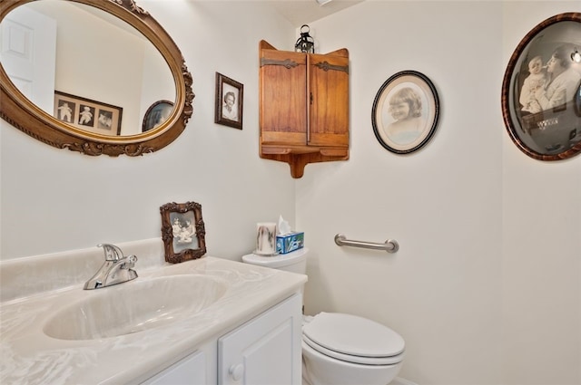 half bath with vanity and toilet