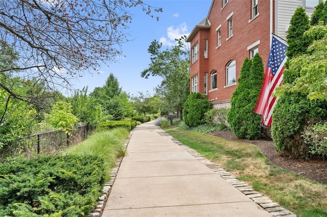 view of property's community featuring fence