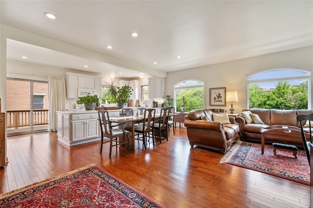 living area featuring recessed lighting and hardwood / wood-style floors